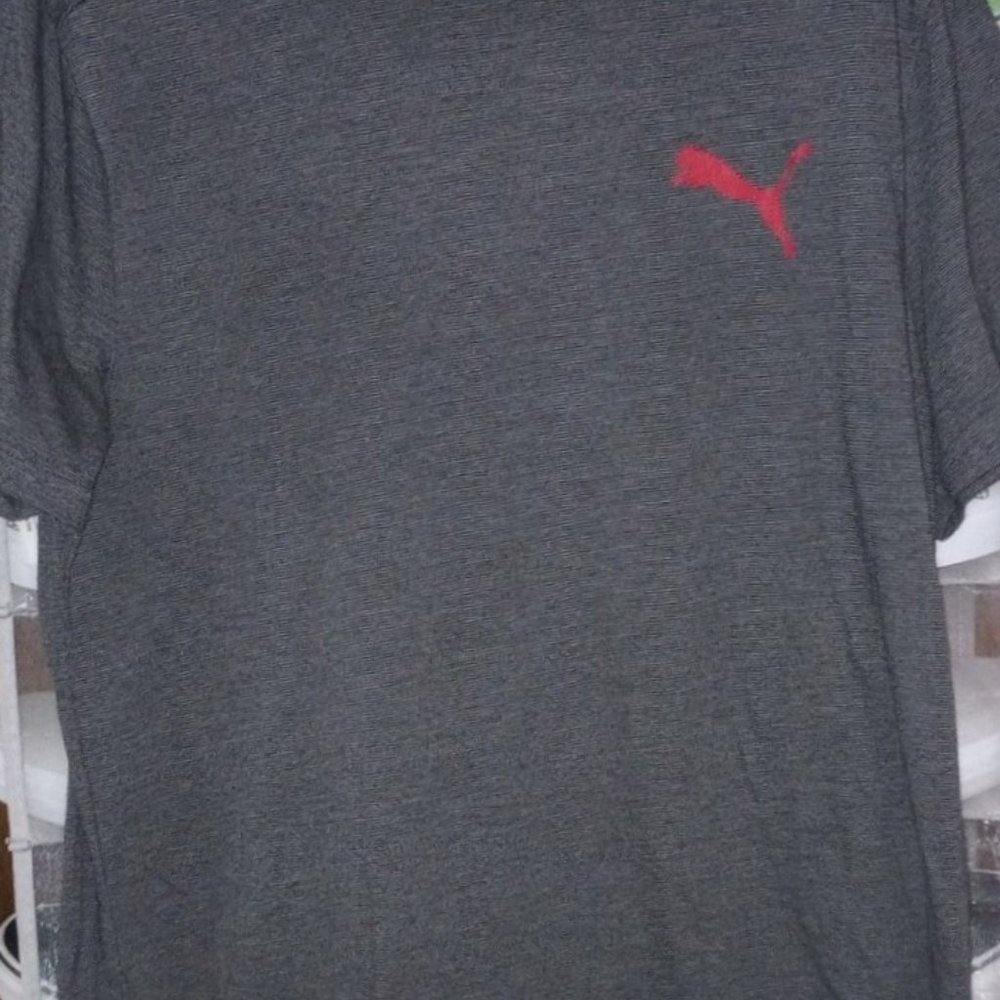 Puma T-shirt for sale. Size large. Soft and comfy material. Never been worn.